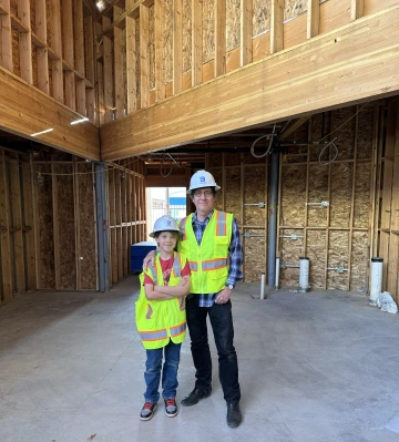 Bob Vint poses for a photo with his grandson Henry at The Loft.